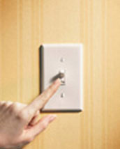 Image of finger switching lightswitch