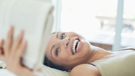 Woman laying down reading