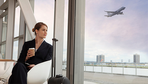 A woman sitting at an airport