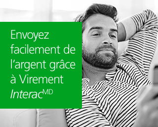 Un homme utilise Virement Interac pour envoyer des fonds en ligne