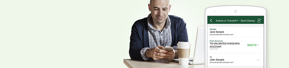 A man uses Interac e-transfer to transfer money online